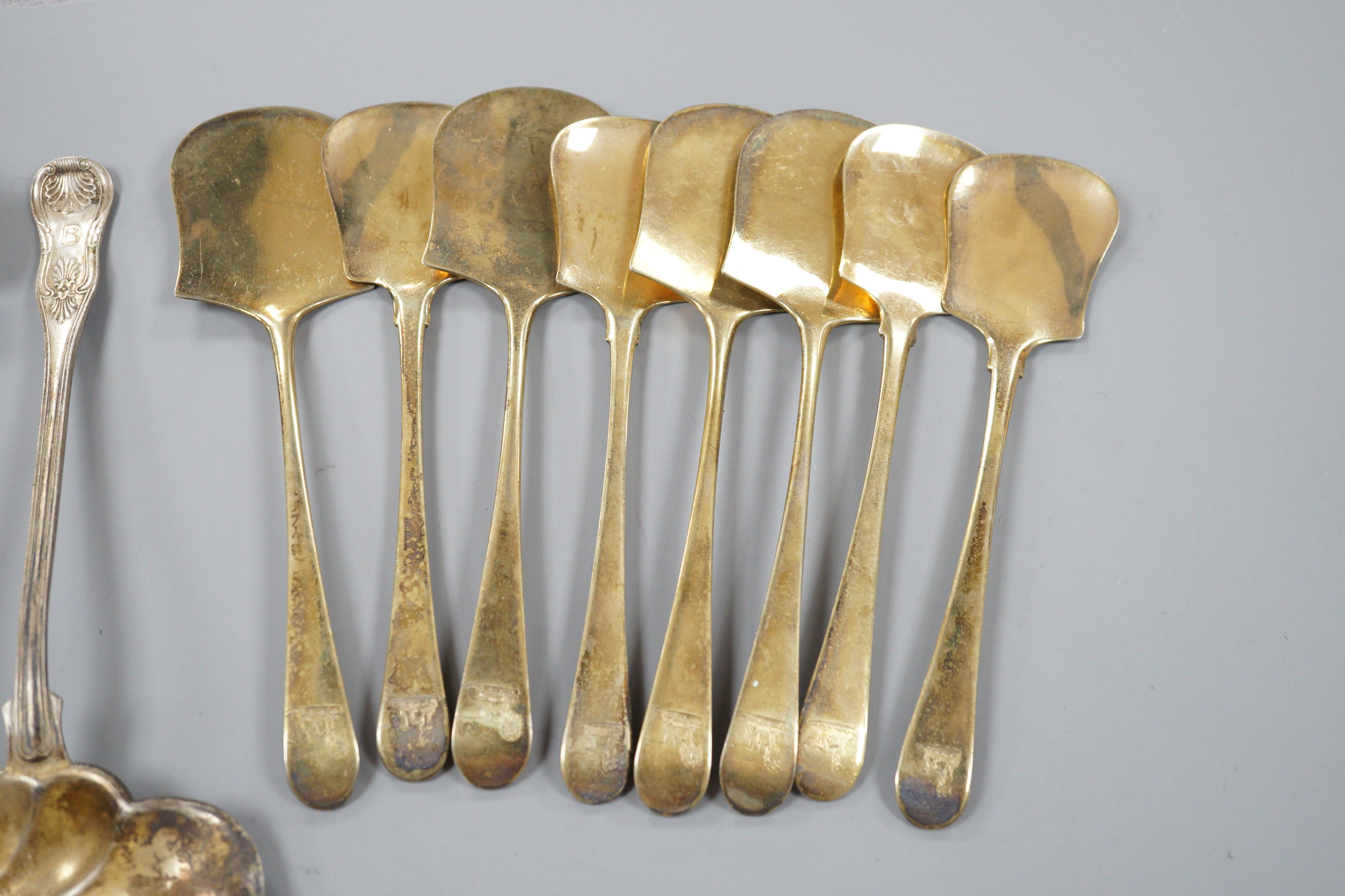 Eight late 18th century/early 19th century French gilt white metal servers, a pair of Swedish ladles and a 19th century German? beaker.